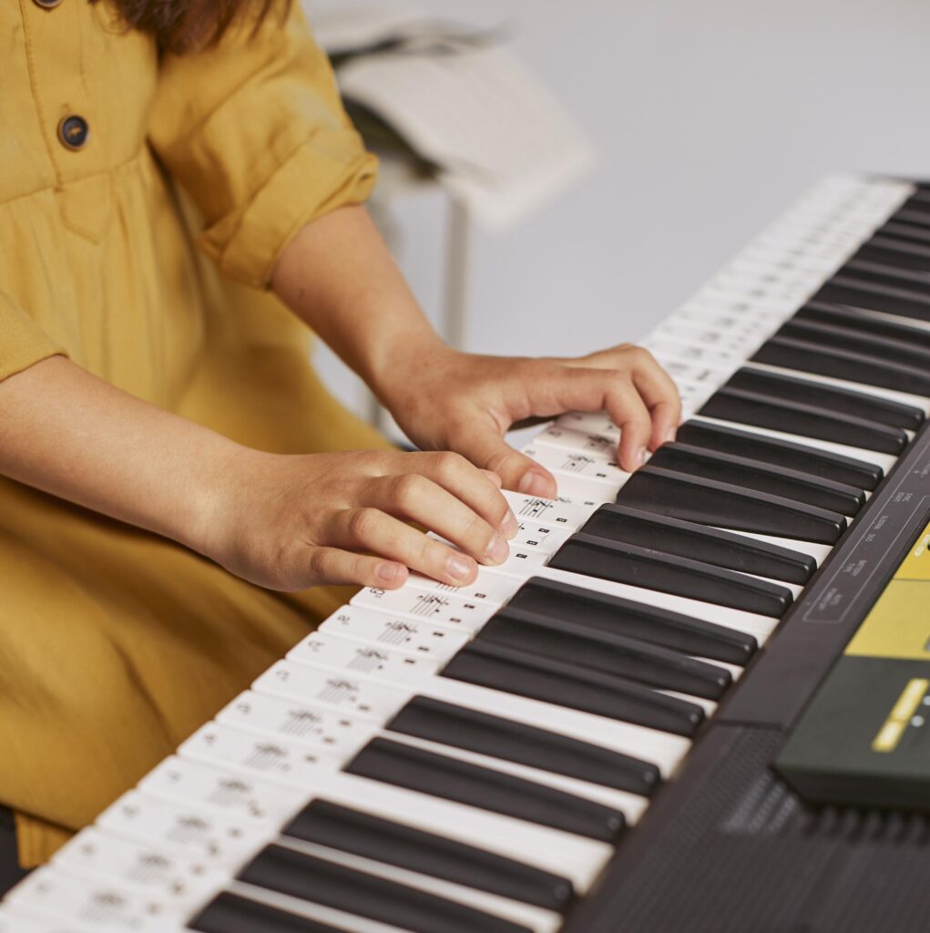 female hands piano girl plays piano musical instrument