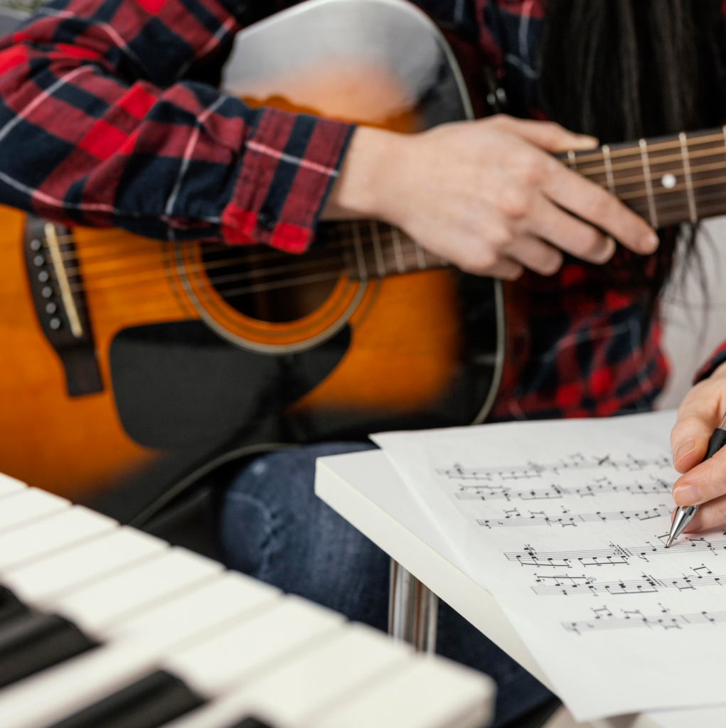 girl learning how-play guitar